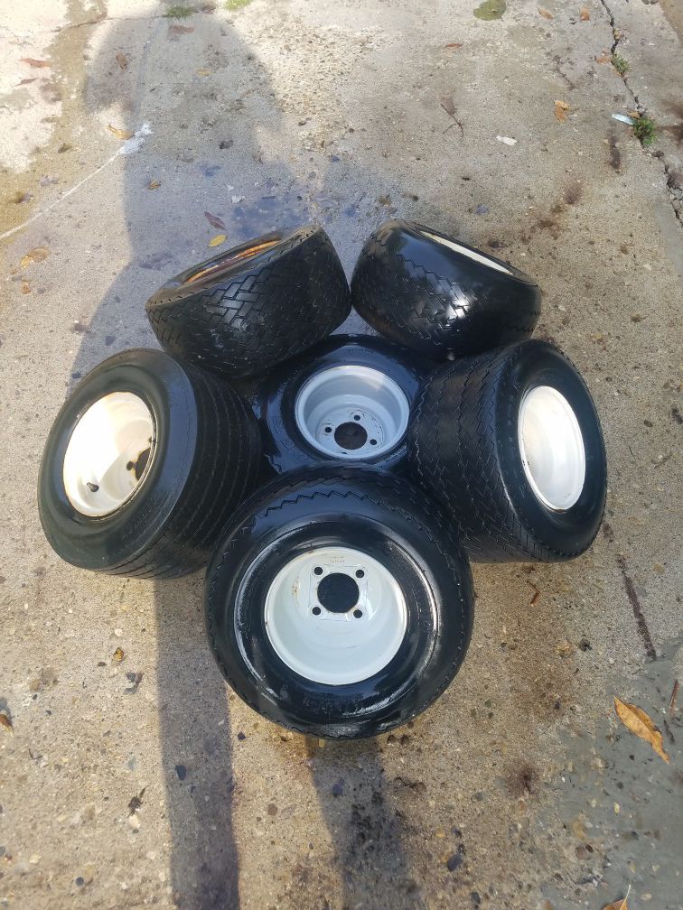 Assorted golf cart wheels and tires