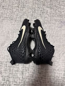Black and white Nike football shoes