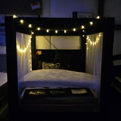 Black new canopy bed frame
