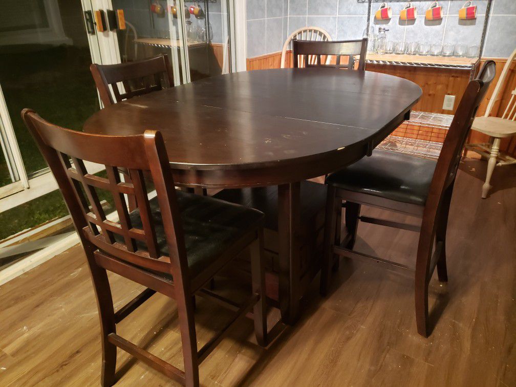 Dark wood kitchen table, remodeling sunroom