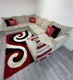 Beautiful 2-Piece Beige Chenille Sectional Sofa with reversible chaise. Delivery available for an additional cost.