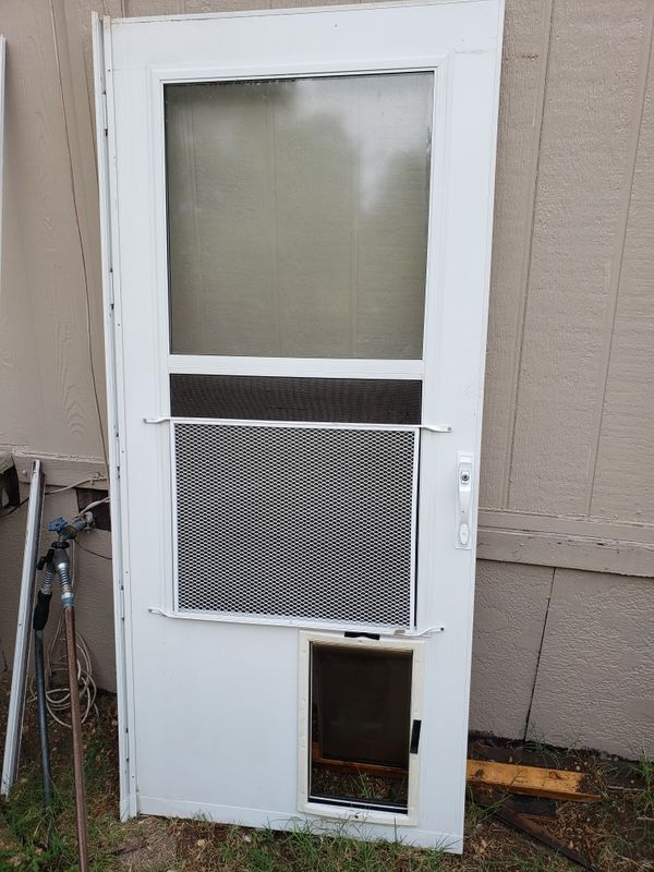 Storm door with built in Pet door for Sale in Lakehills, TX OfferUp