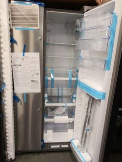 NEW whirlpool side by side doors fridge
