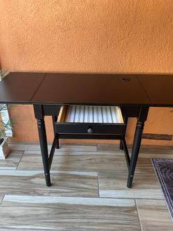 Brown small desk with one drawer and adjustable length