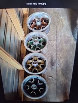 Two sets authentic complete olds,Rally rim