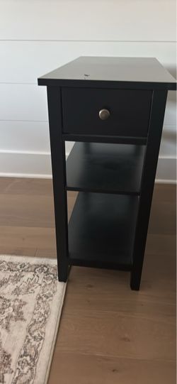Black narrow end table/nightstand with one grater