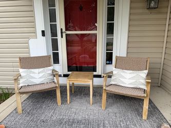 Crate & Barrel wood woven chair set with table. Bonus pillows and outdoor rug
