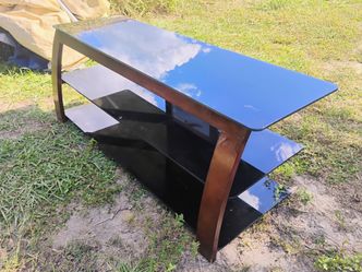 TV stand excellent condition holds up to about a hundred inch TV $50 delivery bill