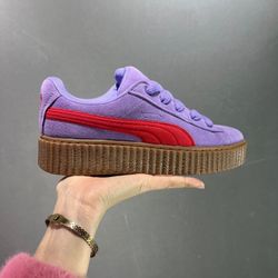A pair of purple-red shoes