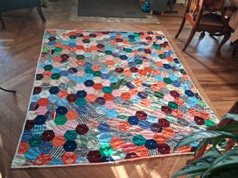 vintage handmade hexagon patchwork quilt and Grandmother's Flower Garden quilt