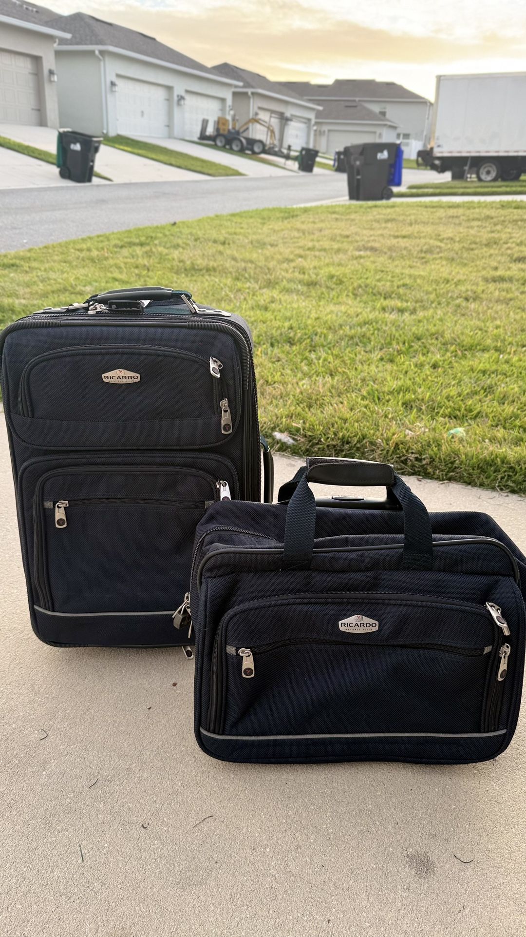 Selling 2 black carry-on suitcases.