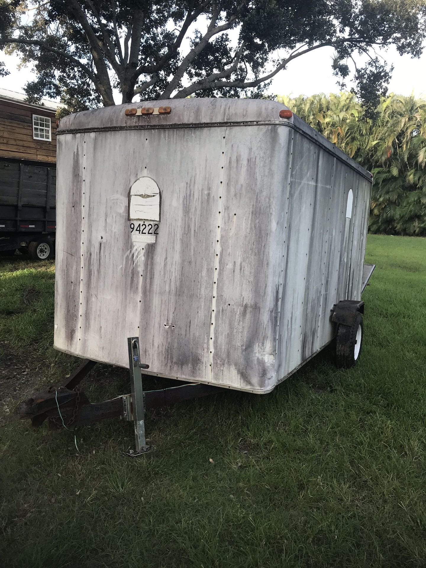 Ugly 12 foot enclosed trailer with rear drop down ramp door