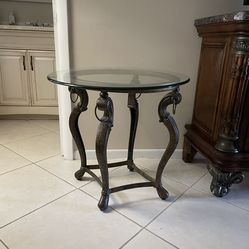 Round glass top side table.
