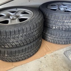 4 Bridgestone snow tires with rims  studless