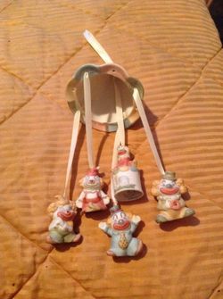 Porcelain hanging clowns