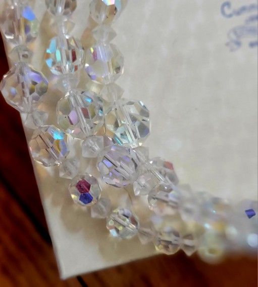 Pink topaz ring and one glass Beaded necklace.