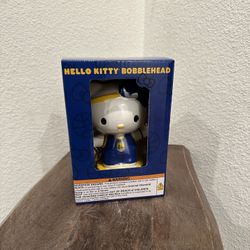 Hello Kitty Bobblehead in the uniform colors of the Golden State Warriors NBA team.