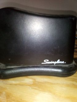 A Miniature Sewing Machine With Charger