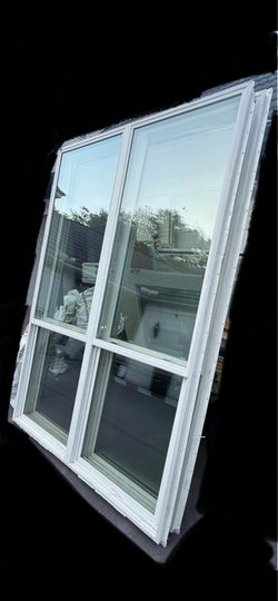 2 Large insulated windows approximately 65x96