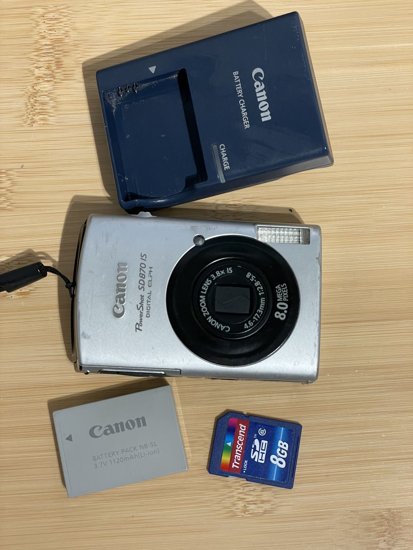 Canon Powershot SD870 IS ELPH Digital Camera - Tested Works  Flash zoom video photo all working. Charger, battery and memory card included. Has cosmet