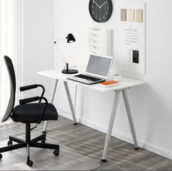 IKEA Desk. Adjustable legs. Desk top is 25" x 47.5" (63 x 120 cm).