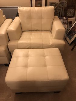 Two Leather Chairs with Ottomans