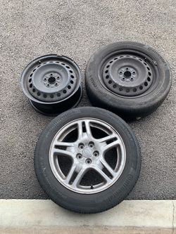 3 Subaru rims and 2 tires