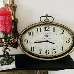 Antique bronze finish French style wall oval clock .