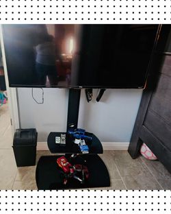 TCL Roku TV with floor stand