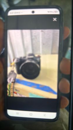 Black DSLR Camera with Lens