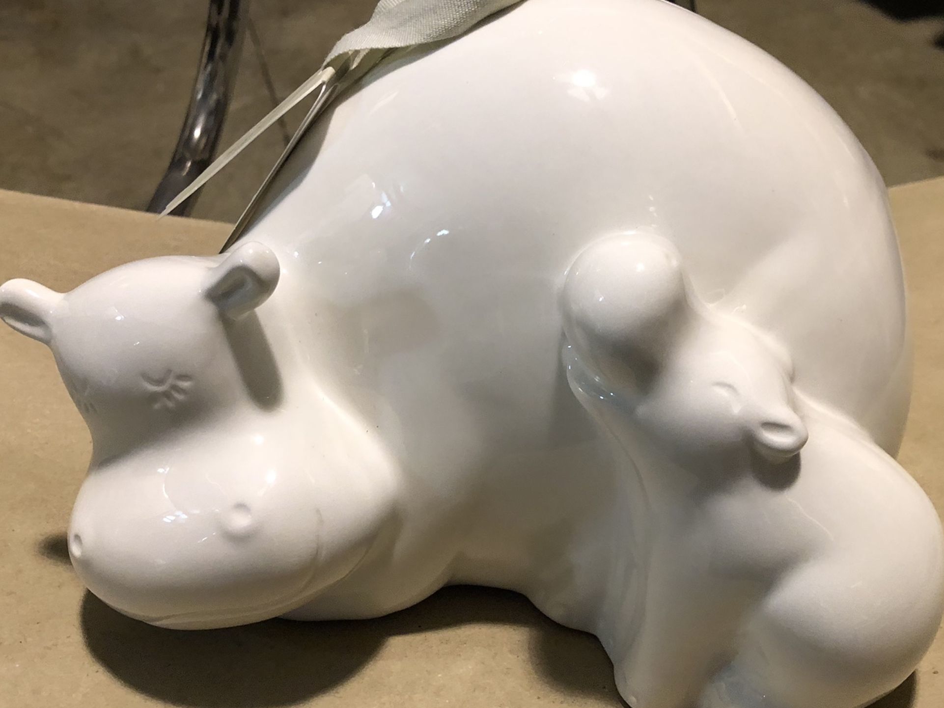 Mama and baby hippo bank