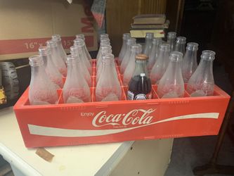 Vintage coca-cola crate full of vintage coke bottles