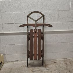 Vintage wood and metal runner sled, likely a "Snow King" or "Yankee Clipper" model. 
