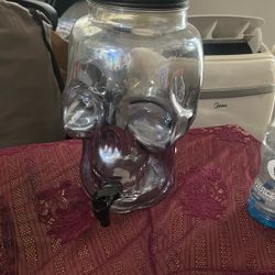 skeleton glass and tin lid juice dispenser