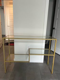 Gold metal + glass console table
