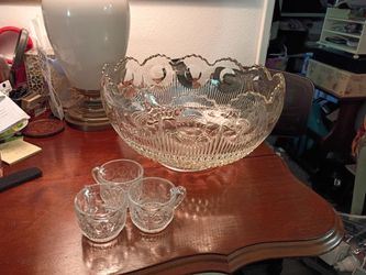 Mid century punch bowl ,pressed glass along with 25 originals matching cups .used only one time in its life.