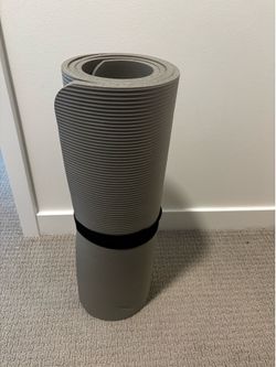Yoga mat with strap