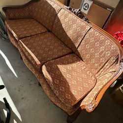 Antique sofa and side chair that were re covered. Wooden carvings on both
