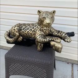 Golden Leopard On The Log Statue