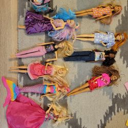 9 Different Barbies With Clothes