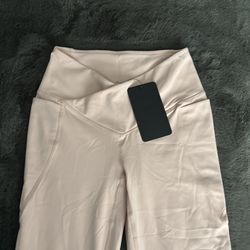 Fabletics high waisted, crossover flare, leggings, and light pink with tags in XS