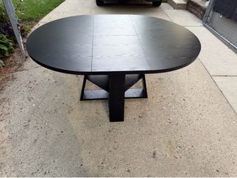Black Oval Dining Table with Removable Leaves