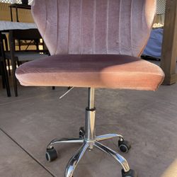Pink rolling chair 
