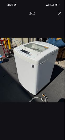 LG 25 Inch Top-Load Washer with 3.6 cu. ft. Capacity Good in Working Condition