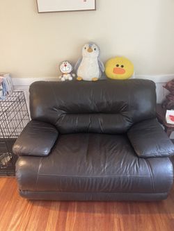 Black Leather Sofa, Adjustable into a bed 