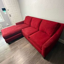 red sectional sofa with a chaise lounge