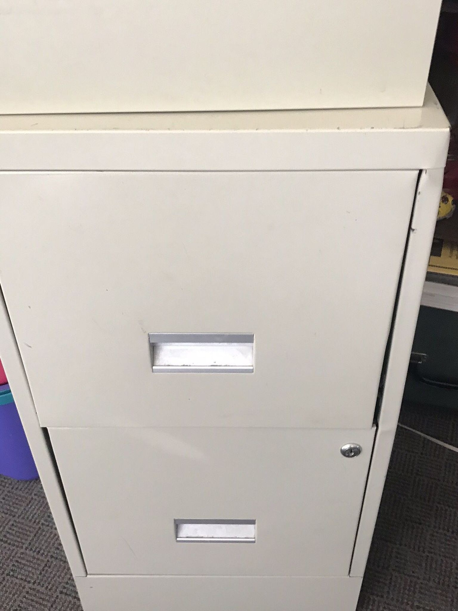 Tan Two drawer file cabinet 29 inches high 18 inches deep 15 inches wide