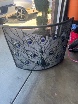 Metal peacock chimney screen