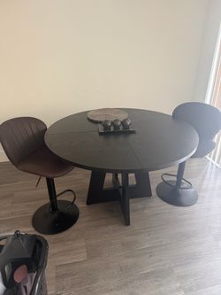 Black round table with 2 chairs