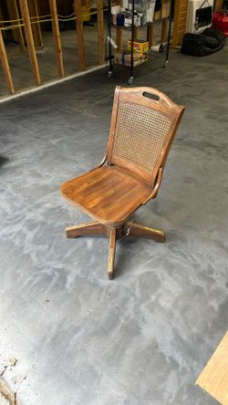 Antique Swivel Chair With Caned Back And Brass Plates